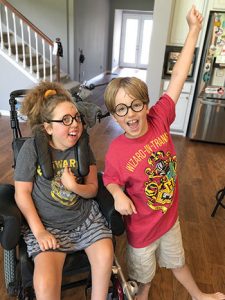 Elena Ozment and her brother Joey celebrate completing the Harry Potter series. <span class="credit"></noscript>Photo: Erin Ozment</span>” width=”225″ height=”300″ srcset=”https://temilib.nasniconsultants.com/wp-content/uploads/2021/03/a-disproportionate-pandemic-1.jpg 225w, https://temilib.nasniconsultants.com/wp-content/uploads/2021/03/a-disproportionate-pandemic-4.jpg 350w” sizes=”(max-width: 225px) 100vw, 225px”><figcaption id=