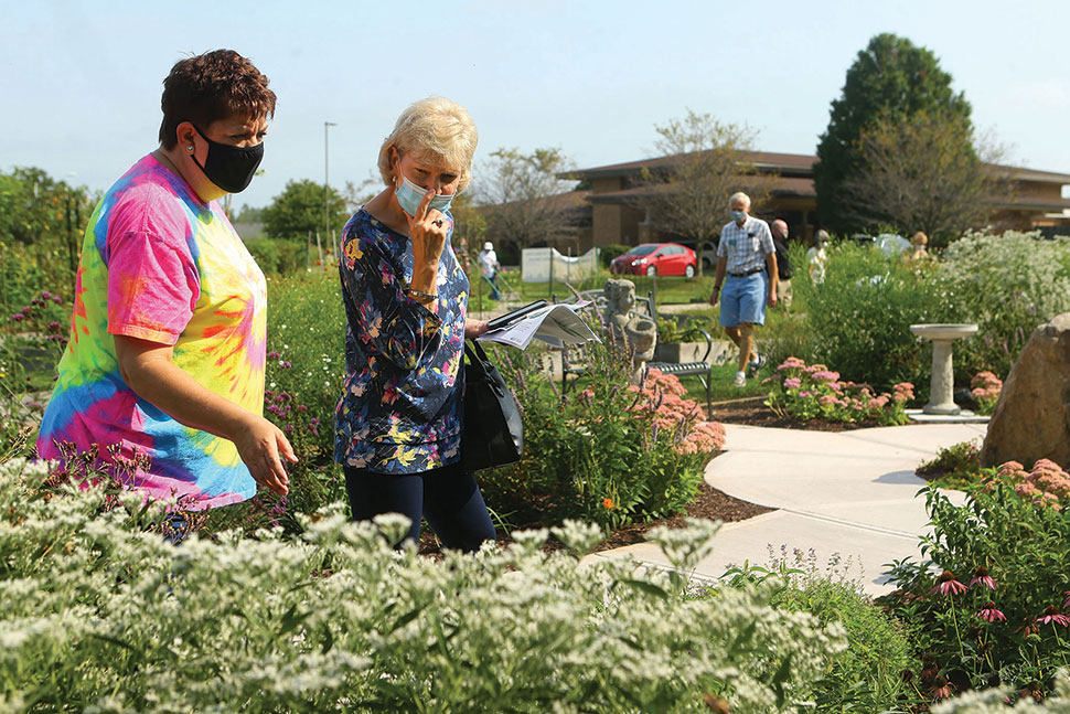 Human visitors explore the butterfly garden at Kokomo–Howard County (Ind.) Public Library’s South branch. (Photo: Kokomo–Howard County (Ind.) Public Library)