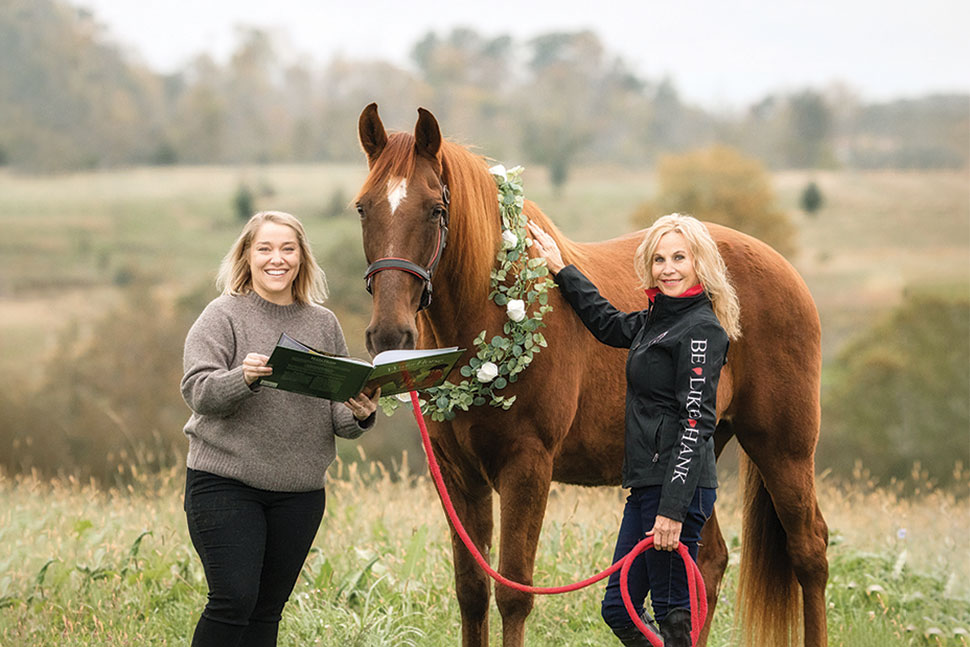 From left: Molly Watson, youth services librarian at Cynthiana-Harrison County (Ky.) Public Library; Hank the Horse; and Hank's owner Tammi Regan of Equinox Stables.