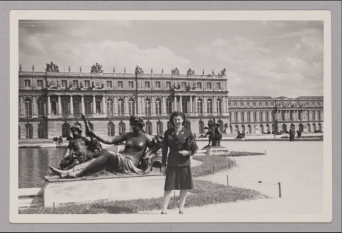 Woman (Sylvia Mathon) standing in front of statues and fountain at Versaille Palace 