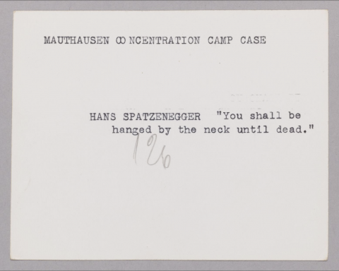 Photograph of the back of a photograph which reads: “Mauthausen concentration camp case Hans Spatzenegger "You shall be hanged by the neck until dead"