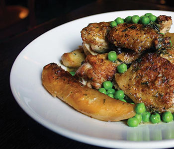 Photo of a plate of Chicken Vesuvio at Harry Caray’s Italian Steakhouse