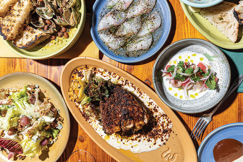 A table with a spread of different seafood dishes