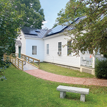 The ADA-compliant ramp and pathway that Orford Social Library was able to build with grant funding. 