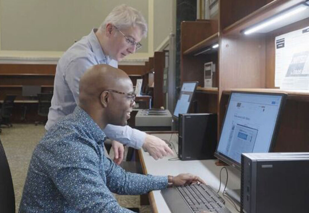 two people using the Stacks terminal in the science & business reading room at the library of congress