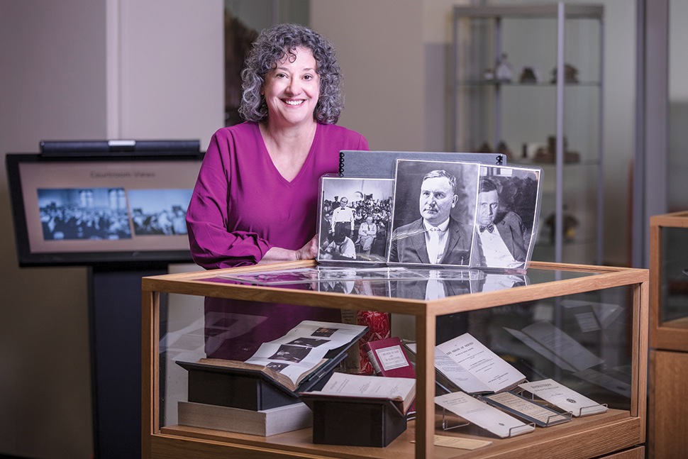 Jennifer Beals, assistant dean and director of the Betsey B. Creekmore Special Collections and University Archives at University of Tennessee, Knoxville (UTK), poses with items from the library's Scopes Trial collection.